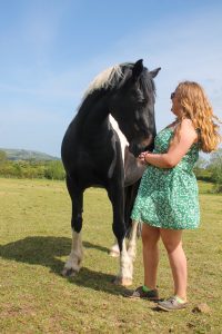 Horse and owner posing