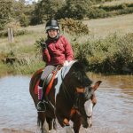 Horse & rider going through water complex