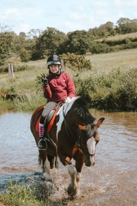 Horse & rider going through water complex